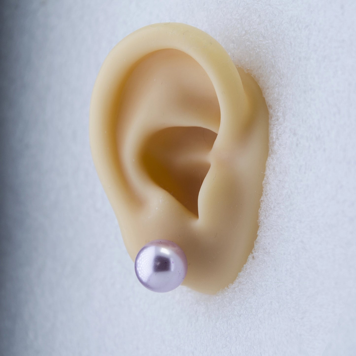 Rhodium Plated Shimmering Pearl Stud Earrings - light Purple